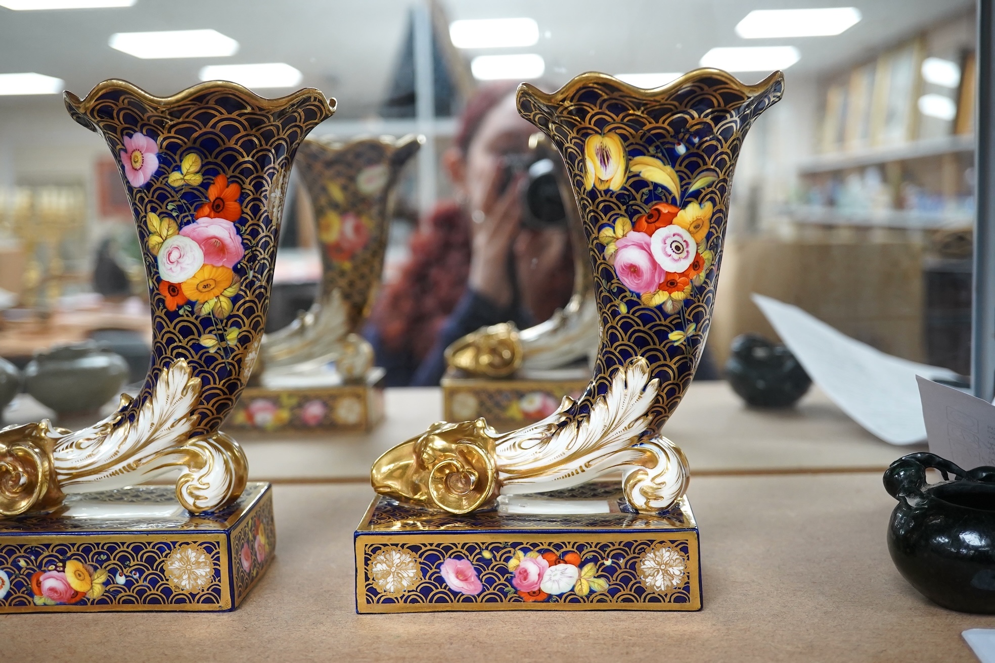 A pair of Spode-type cornucopia vases, 18cm high (a.f.). Condition - restored